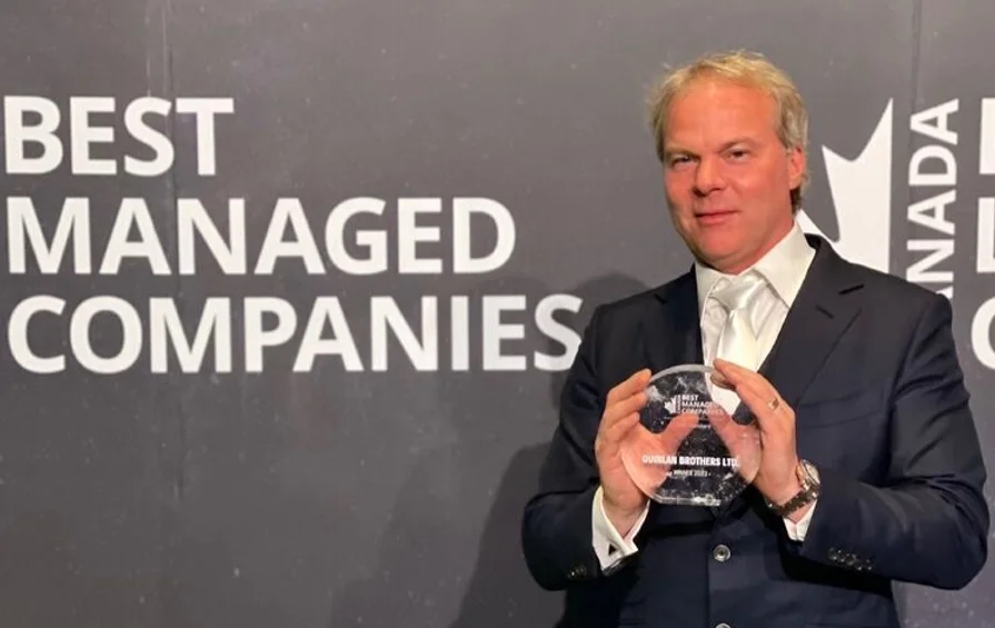 Robin Quinlan holding best managed companies award